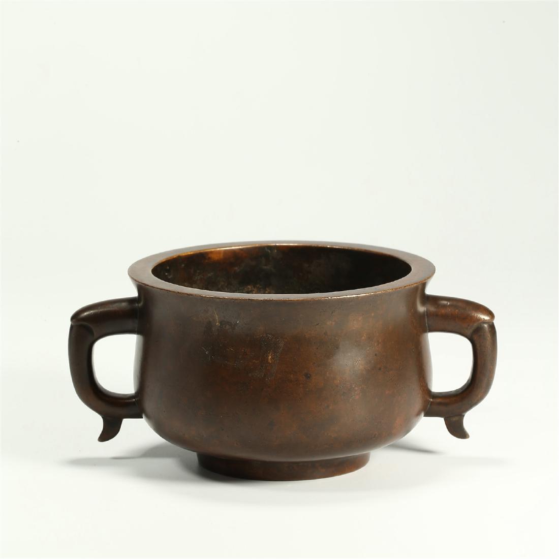 A CHINESE BRONZE DOUBLE HANDLED CENSER (1 of 5)