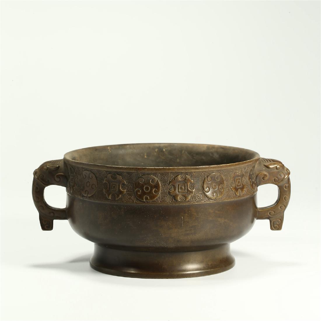 A CHINESE BRONZE DOUBLE BEAST HANDLED CENSER (1 of 5)