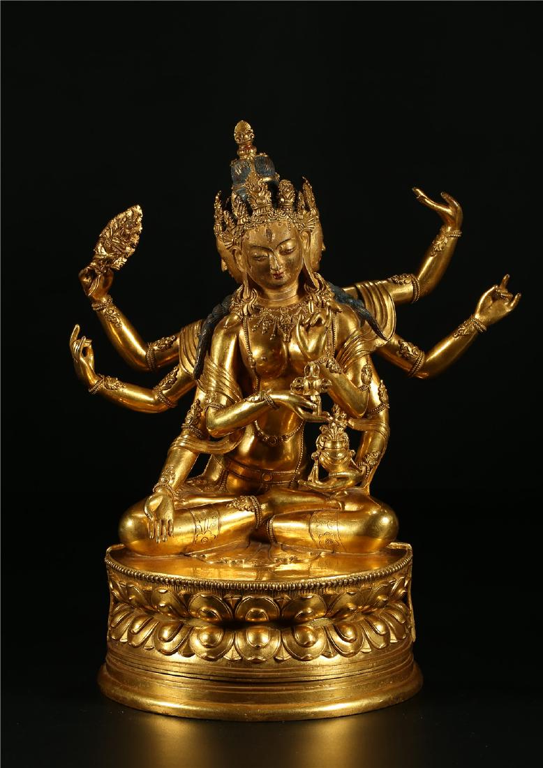 A CHINESE GILT BRONZE FIGURE OF EIGHT ARMED GUANYIN (1 of 7)