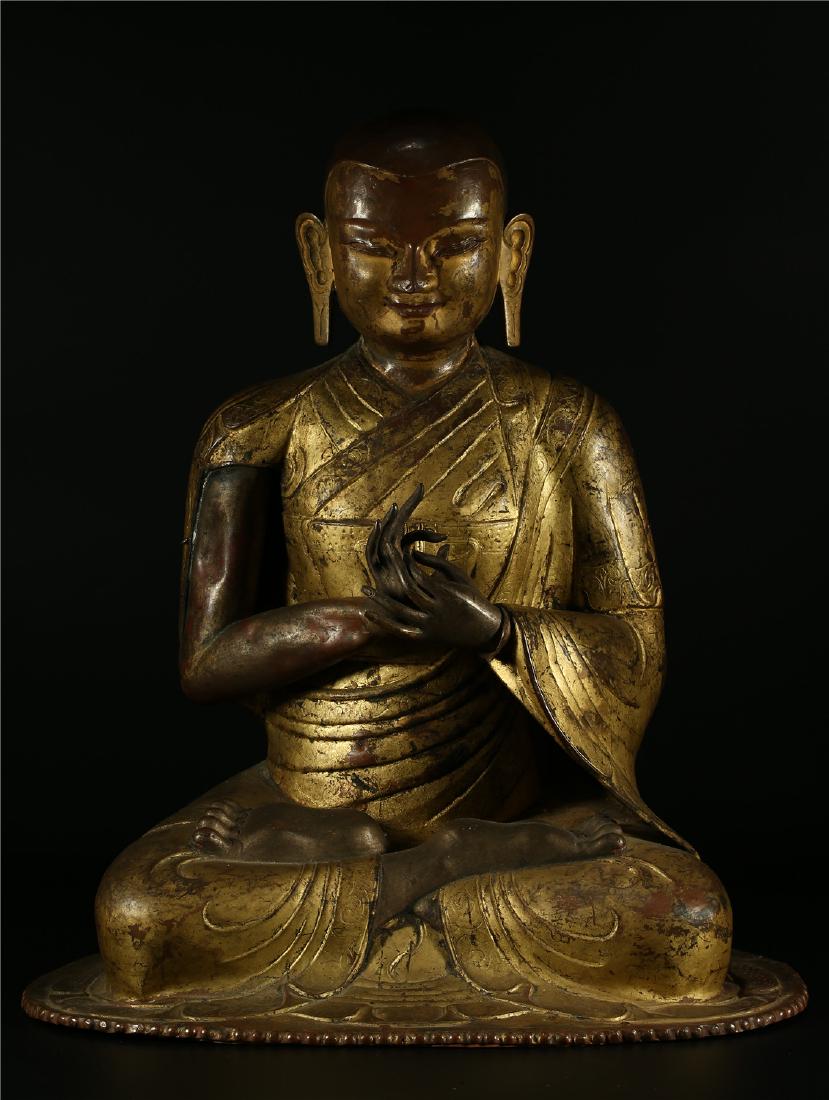 A GILT BRONZE FIGURE OF A LAMA (1 of 10)