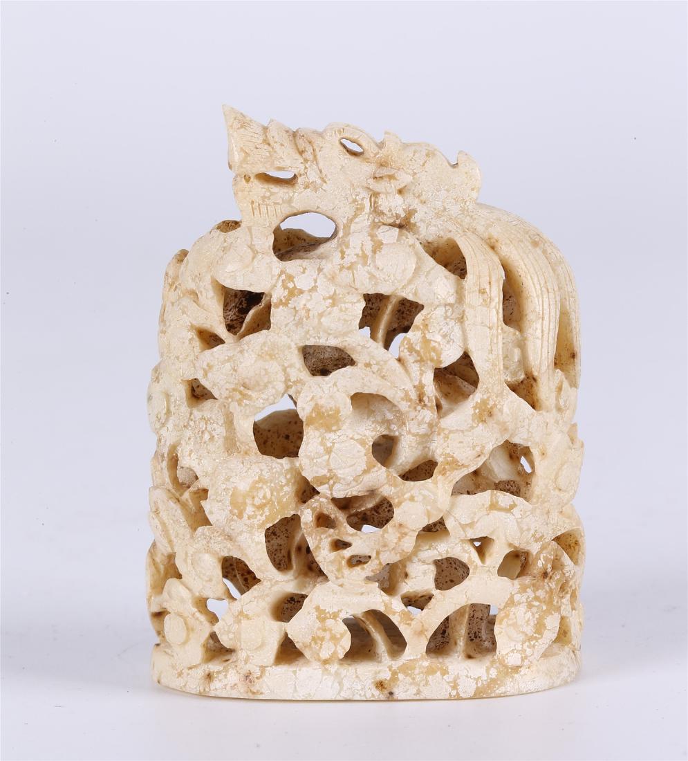 A CHINESE CHICKEN BONE JADE "DRAGON" CENSER COVER: 2 3/4 inches high.