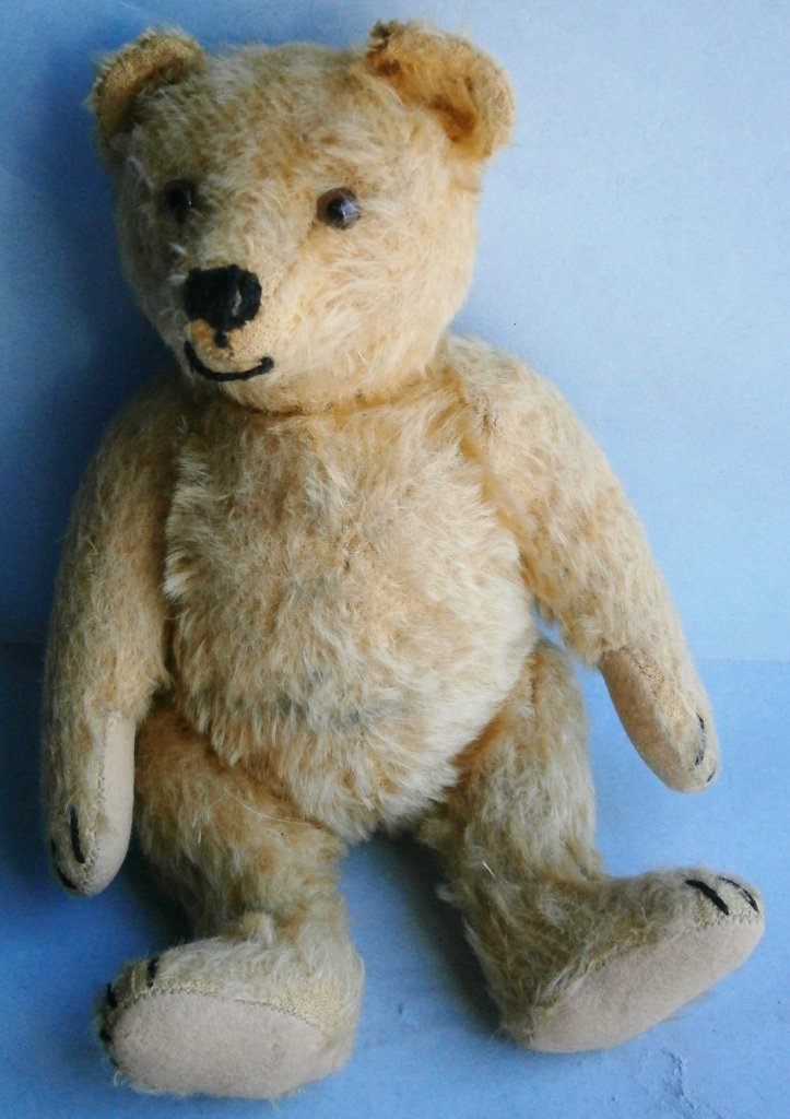 Vintage mohair Bear: Vintage mohair Bear, 9 1/4 in. tall, fully jointed, squeeze box in chest not working, glass eyes.