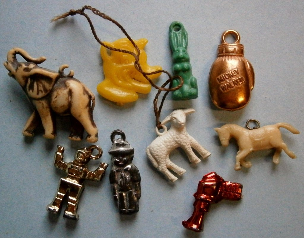 Assorted Vintage Charms from the 1930’s-50’s: Assorted Vintage Charms from the 1930’s-50’s, robot, Mickey Walker, other animals, the space gun is missing the string ring, most missing strings, celluloid and plastic.