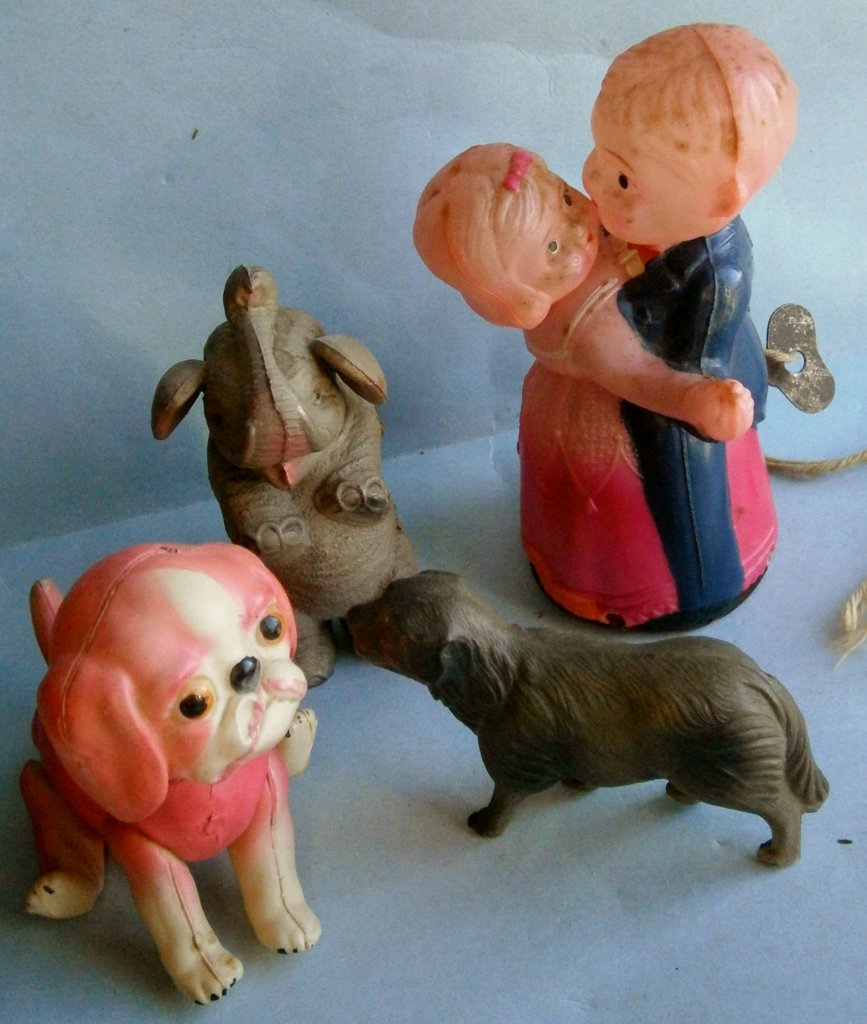 4 Old Celluloid Toys from the 1930s-40s: 4 Old Celluloid Toys from the 1930s-40s, consisting of a dancing couple wind-up toy in working condition, small split on back of base, a wind-up celluloid elephant made in Japan, pre-war, not working,
