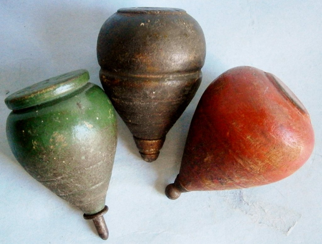 3 19th Century Wood Toy Tops made in USA: 3 19th Century Wood Toy Tops made in USA, turned wood with metal tips, all different.