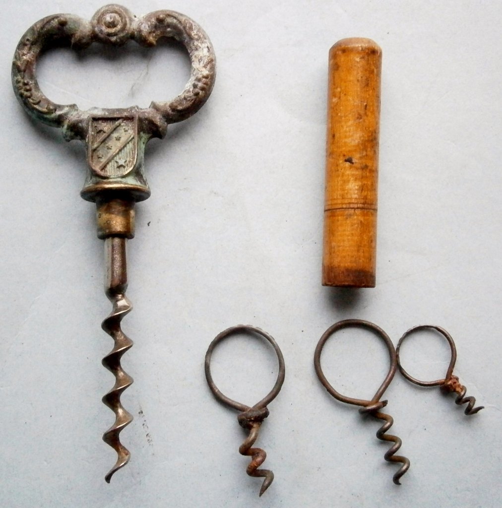 3 Medicinal Wire Corkscrews: 3 Medicinal Wire Corkscrews and other partial corkscrew, the medicinal corkscrews are from 1 in. to 1 5/8 in. long, together with a screw portion of a figural key corkscrew and a 2 1/2 in. long wood c