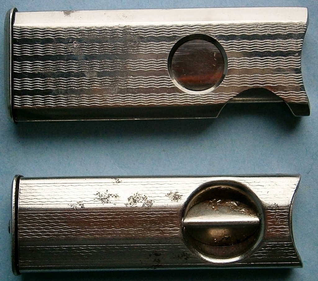 Pair of 1930s Art Deco Pocket Cigar Cutters made in: Pair of 1930s Art Deco Pocket Cigar Cutters made in Germany, chrome plated, 2 in. and 2 1/8 long in closed position, marked Germany. Â