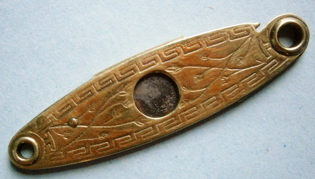Old Gold Filled Pocket Cigar Cutter marked "Pat.: Old Gold Filled Pocket Cigar Cutter marked "Pat. Applied For" probably from the late 19th century, 2 1/4 in. long, very attractive decoration.