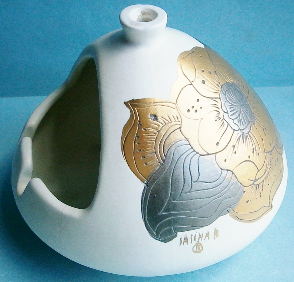 Sascha Brastoff Mid Century Modern Chimney Style: Sascha Brastoff Mid Century Modern Chimney Style Ashtray with Floral Motif, a beautiful cream colored pottery ashtray with a metallic incised floral motif, signed â€œSASCHA Bâ€, 4 Â½ in. tall