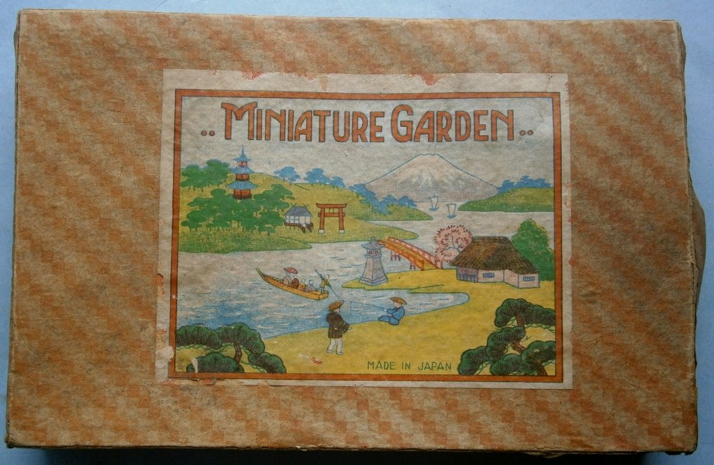 MINIATURE GARDEN Japanese Garden Set: MINIATURE GARDEN Japanese Garden Set made in Japan, c.1920s-30s, box measures 7 1/4 x 4 3/4 in., figures are made of hand painted bisque, looks like one piece is missing and duck has no feet, box is w