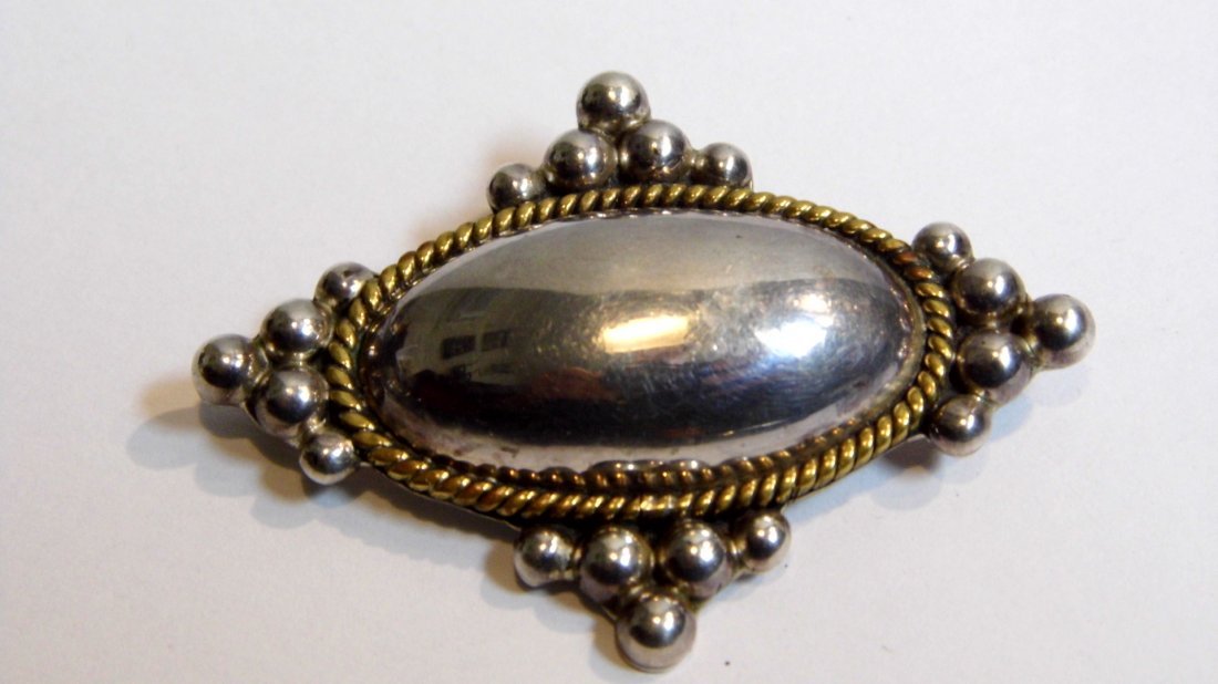 Laton Taxco Heavy Sterling Silver Brooch Pendant: Mixed metals stylized cross pendant or brooch. Laton is a design house and retailer. Their signature design is a brass or bronze and silver, mixed metals look. This piece has sterling marks and Taxco