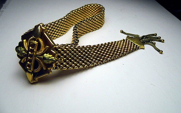 Vintage Victorian Revival Gold Tone Bracelet w/ Tassel: Beautiful bracelet fits almost any wrist. Patented knotch clasp adjustment (see photo). Accented in lemon and yellow gold.