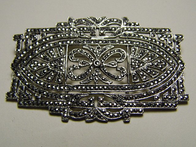 Vintage Art Deco Sterling Silver Marcasite Pin: Sizable pin. Nothing missing. Marked sterling on back. Very good condition.