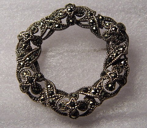 Vintage Sterling Silver Marcasite Brooch: Disigner initials and 925 silver mark. Good condition. All intact.