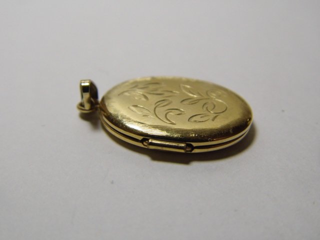 Pretty Chased Ovoid Locket Pendant: Fine condition with loop and bail.