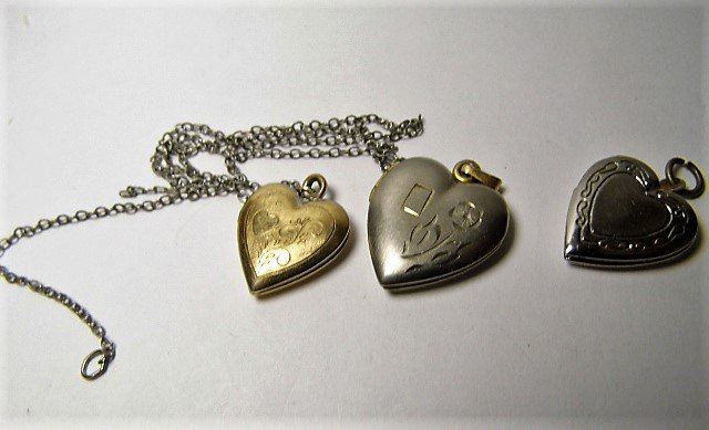 Three Vintage Lockets Pendants: The first one needs a clasp for the 16 inch chain. The second one doesn't snap shut. The third one is good to go.