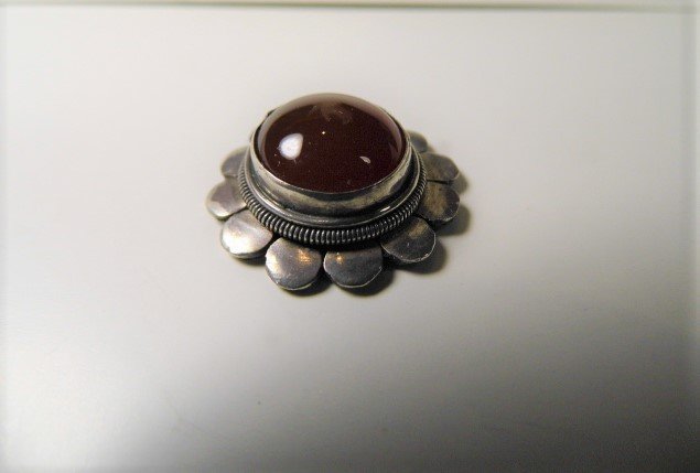Asian Antique Sterling Silver Carnelian Medallion: Unknown. Perhaps once a part of a pendant necklace, but no signs of breakage or loop. High detail floral form. Nice for repurpose.