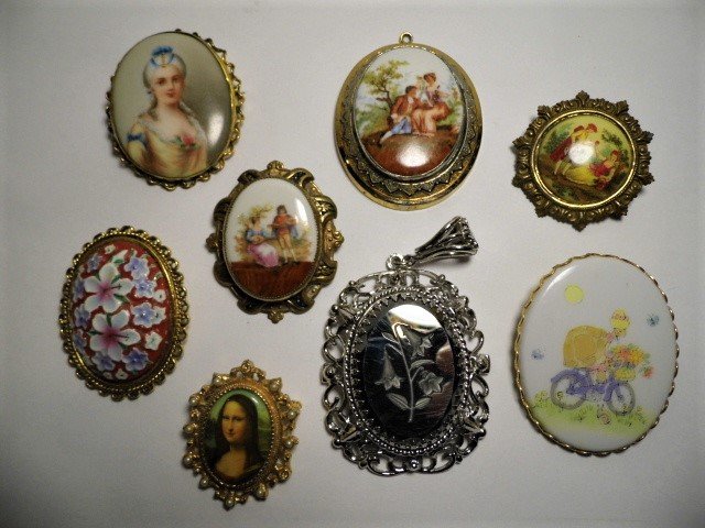 Lot 8 Vintage Brooches 7 Porcelain 1 Intaglio Glass: Several are quite old. All wearable. One brooch has an amateur repair to clasp. Intaglio brooch has some scuffing.