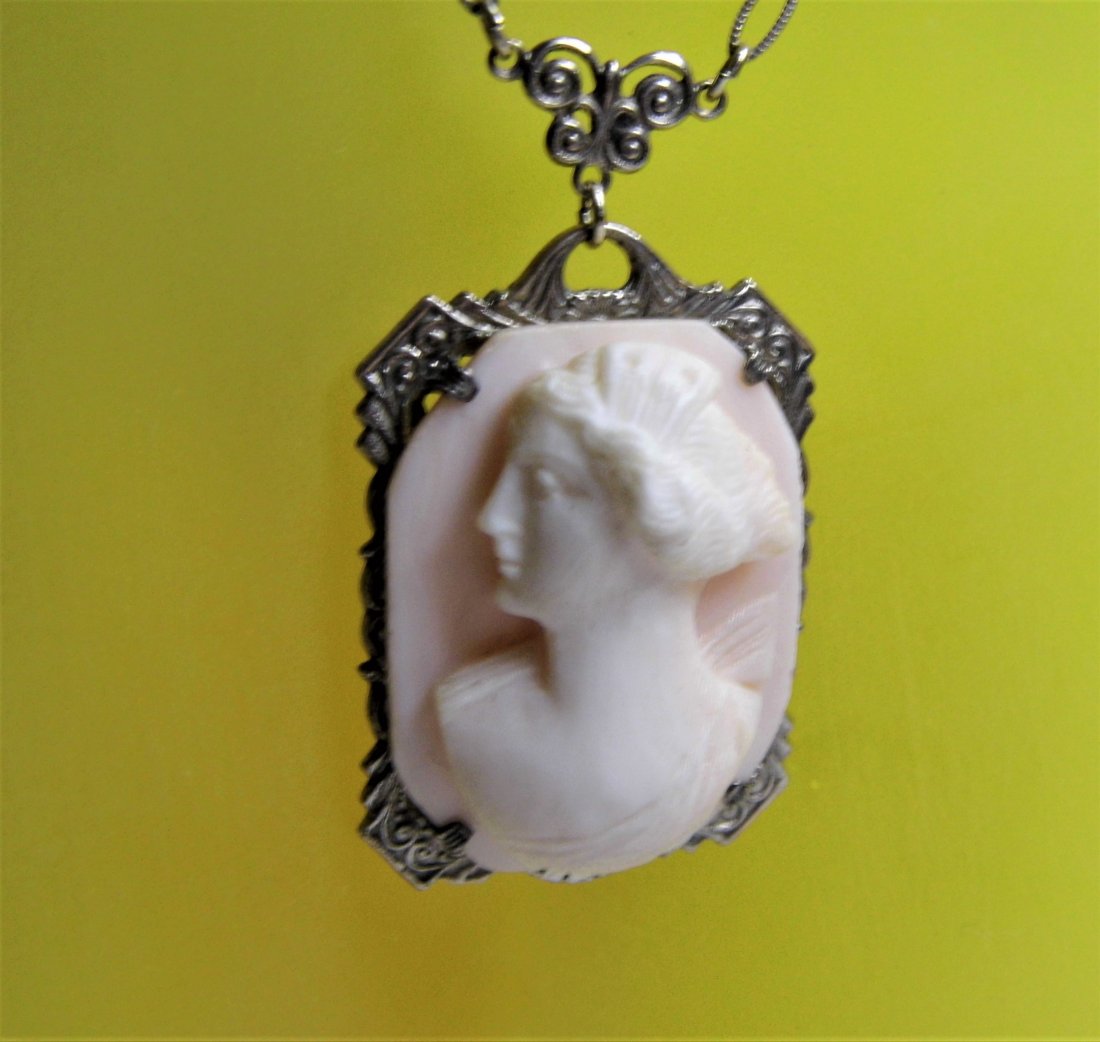 Antique Sterling Silver Angel Skin Shell Cameo Necklace: Real beauty. No chips, cracks or repairs. Bezel marked sterling. 18 inch chain. 1 1/4 inch drop.