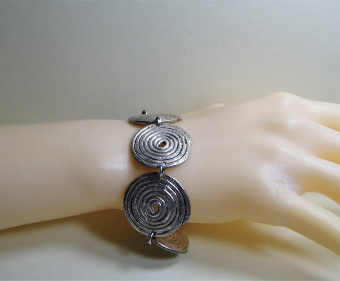 Ethnic Hmong Chinese Tribal Silver Bracelet: Age unknown, but at least old vintage if not antique. Origin could also be Laotian or Vietnamese. A little over 8 inches end to end. Iconic Hmong form. Heavy silver disks. Bracelet weighs a couple oun