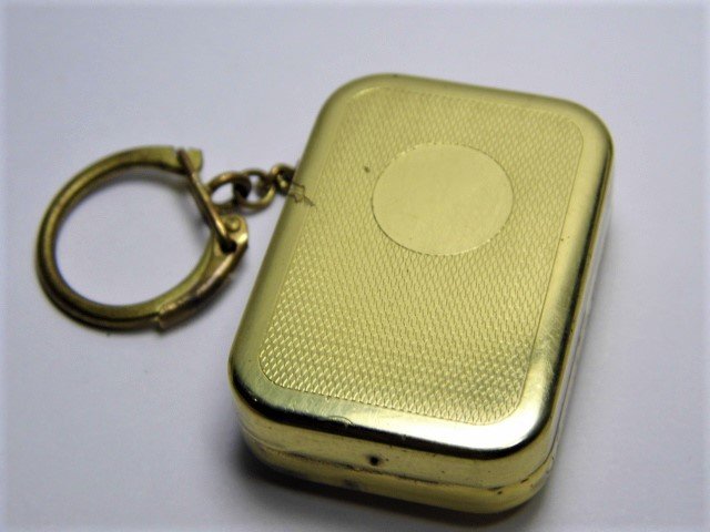 Vintage World's Smallest Swiss Music Box Key Chain: Made in Confederatio Helvetia, the confederation of the Helvetians. known as Switzerland by the English speakers. Brand name is Thorens. Marked St Croix, Suisse (Switzerland). Plays a sweet tune.