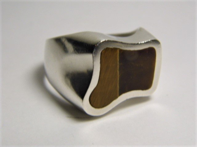 Large Vintage Modernist Sterling Tiger\: Marked Mexico and 925. High quality sterling silver cast ring with beautiful recessed mount tiger\'s eye stone. Size 12.