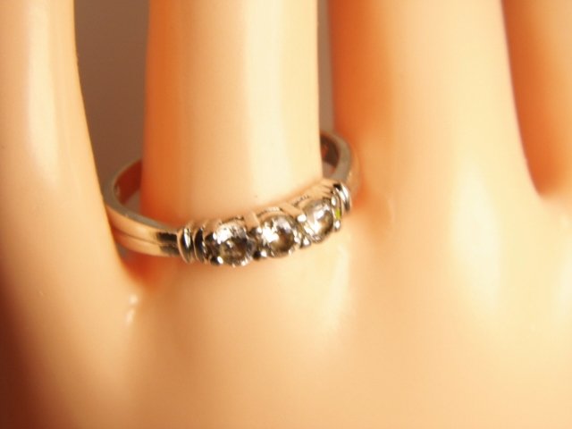 Sterling Silver Ring size 8: Cute ring in fine condition. Prong mounted cut crystal stones. Marked China 925.