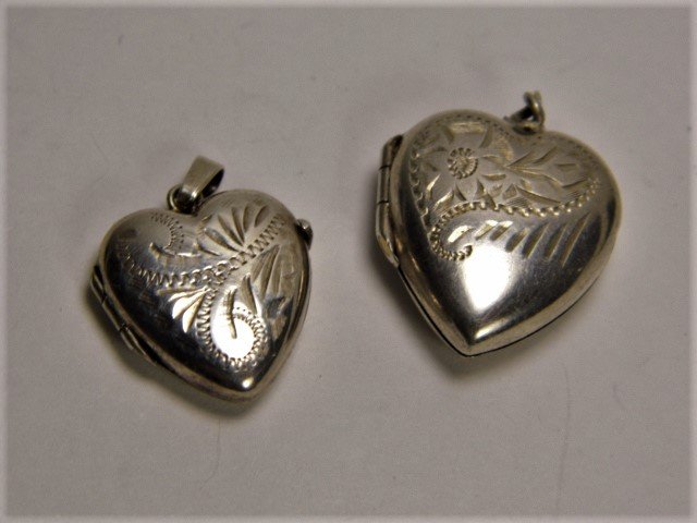 Pair Vintage Silver Heart Locket Necklace Pendants: Both marked silver on the back. Floral engraving. Hinges good. Lockets designed for double elements inside.