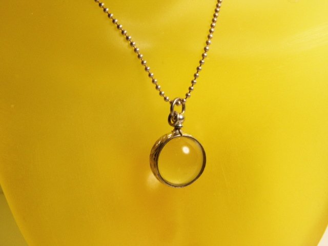 Vintage Orb Necklace Pendant Bauble: Strange crystal like orb with unusual reflection elements and inclusions. Engraved bezel. Has a loop and a large bail. No marks.