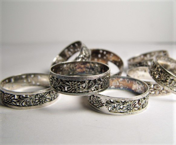 10 Old New Stock Edelweiss Silver Rings 8 1/2 to 10 1/2: Sizes 8 1/2 to 10 1/2. From a closing jewelry store in Kufstein, Austria 1980's. Rings are silver. No marks. Traditional rings usually given to wedding attendants.
