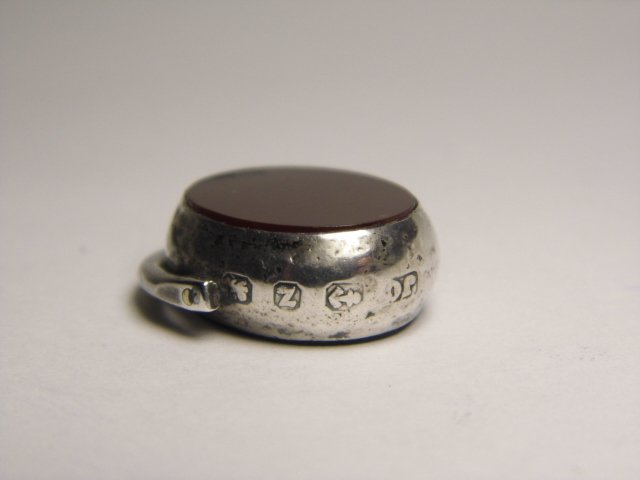1899 Hallmark Sterling Swivel Fob Carnelian Bloodstone: Swivel fob. Bloodstone pane on one side and carnelian on the other side. Hallmarked for sterling silver, city of Birmingham, England, date letter z for 1899. Maker was JC for Joseph Carnell, first reg