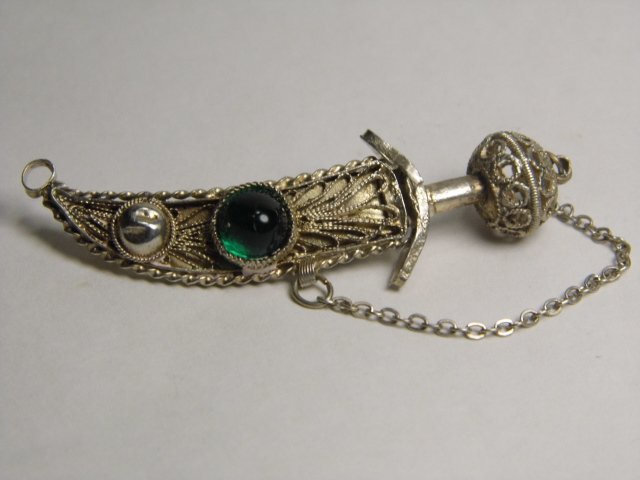 Vintage Silver Filigree Jambiya Sword Pendant: Cool little costume necklace pendant. Illegible mark on sword blade. Watch out..it's sharp!