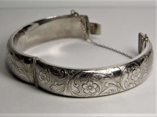 Vintage English Sterling Silver Chased Bracelet 1972: Full English hallmarks. Heavy sterling silver with good clasp and catch chain. No dents. Marks are for sterling silver, city of Birmingham and date letter for 1972.