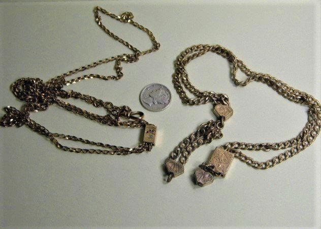 Pair Victorian Antique Gold Plate Slide Watch Fobs: Smaller chain is 44 inches. Large chain is 24 inches. Slides operational. Total weight is 1.03 troy ounces.