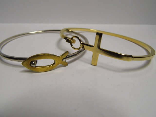 Pair Christian Inspired Misec Metal Bracelets: Fish bracelet has sterling silver mark and a Taxco mark. Cross bracelet is gold electroplated. Both are nearly 8 inches circumference.