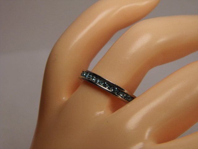 Fine Little Sterling Silver Enfilade Ring size 6 1/2: Marked 925 for sterling silver. Fine little stones, probably little blue zircons. One missing.