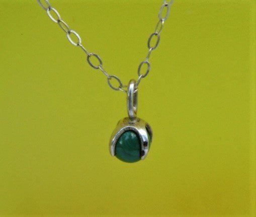 Sterling Silver Malachite Ball Claw Pendant Necklace: Elegant little pendant necklace. 17 inch sterling silver chain.