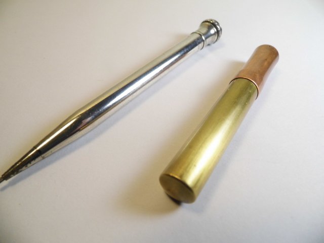 Pair Cool Things: A secretary's pencil and a cylinder case. Pencil works fine. Has loop for chain. Marked Wahl Eversharp Silverplate.