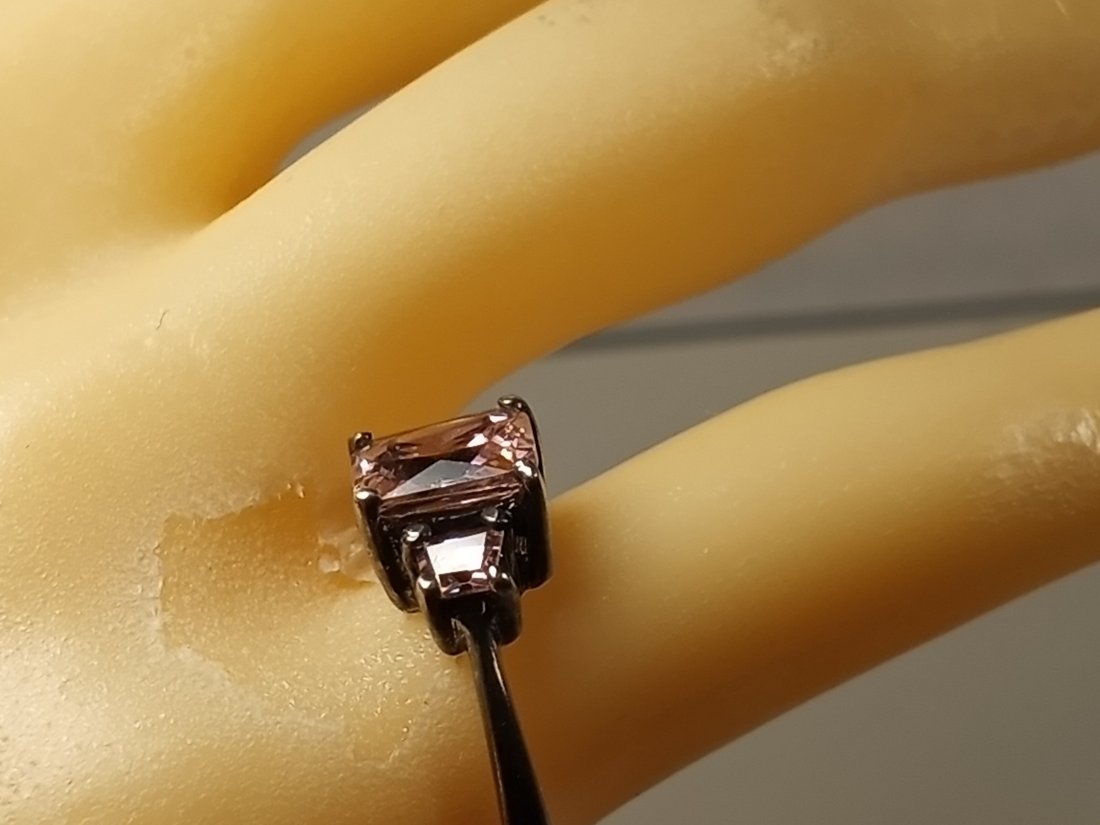 Sterling Silver Pink Ice Ring: Beautiful Zircon stones. Marked sterling inside band.