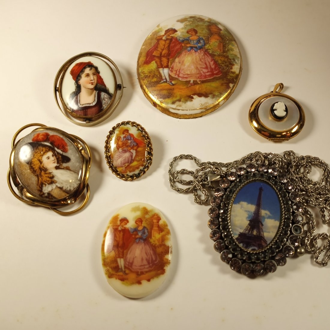 Antique or Vintage Jewelry Elements: Porcelain painted brooches are genuine. One is transfer, the other hand-painted. Nicel little double locket. Medallions, etc.