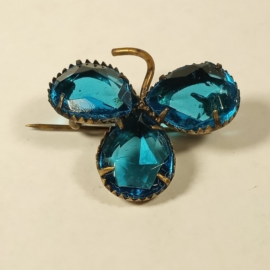 Pretty Antique Clover Pin: Circa 1920's. Beautiful aqua paste stones prong mounted.