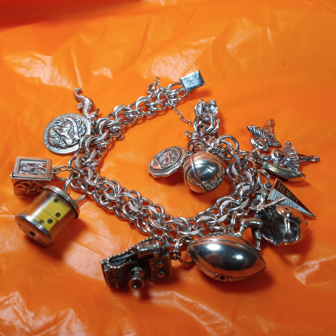 Vintage Player's Sterling Silver Charm Bracelet Dice & Cards: Fifteen charms. Most have a sterling silver mark. Bracelet marked Elco sterling. There are captive dice and poker cards for good luck at the casino.
