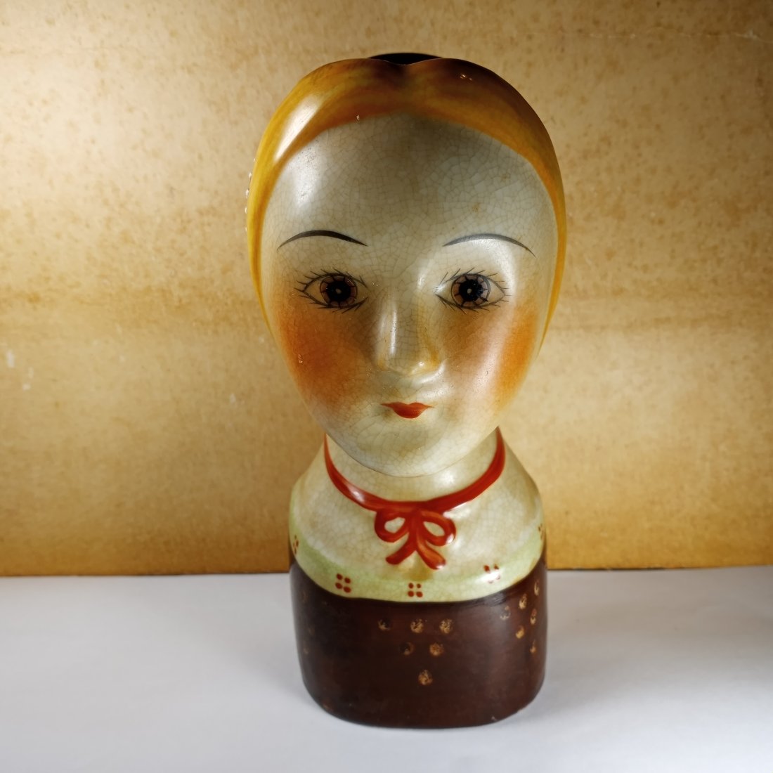 Gemma Taccogna Scandia Style Wall Head Vase: Gemma Taccogna worked in papier mache. After her death it was nigh impossible to repeat in her stule in papier mache. So artists and craftspeople worked in clay and porcelain. Here is a link to info o