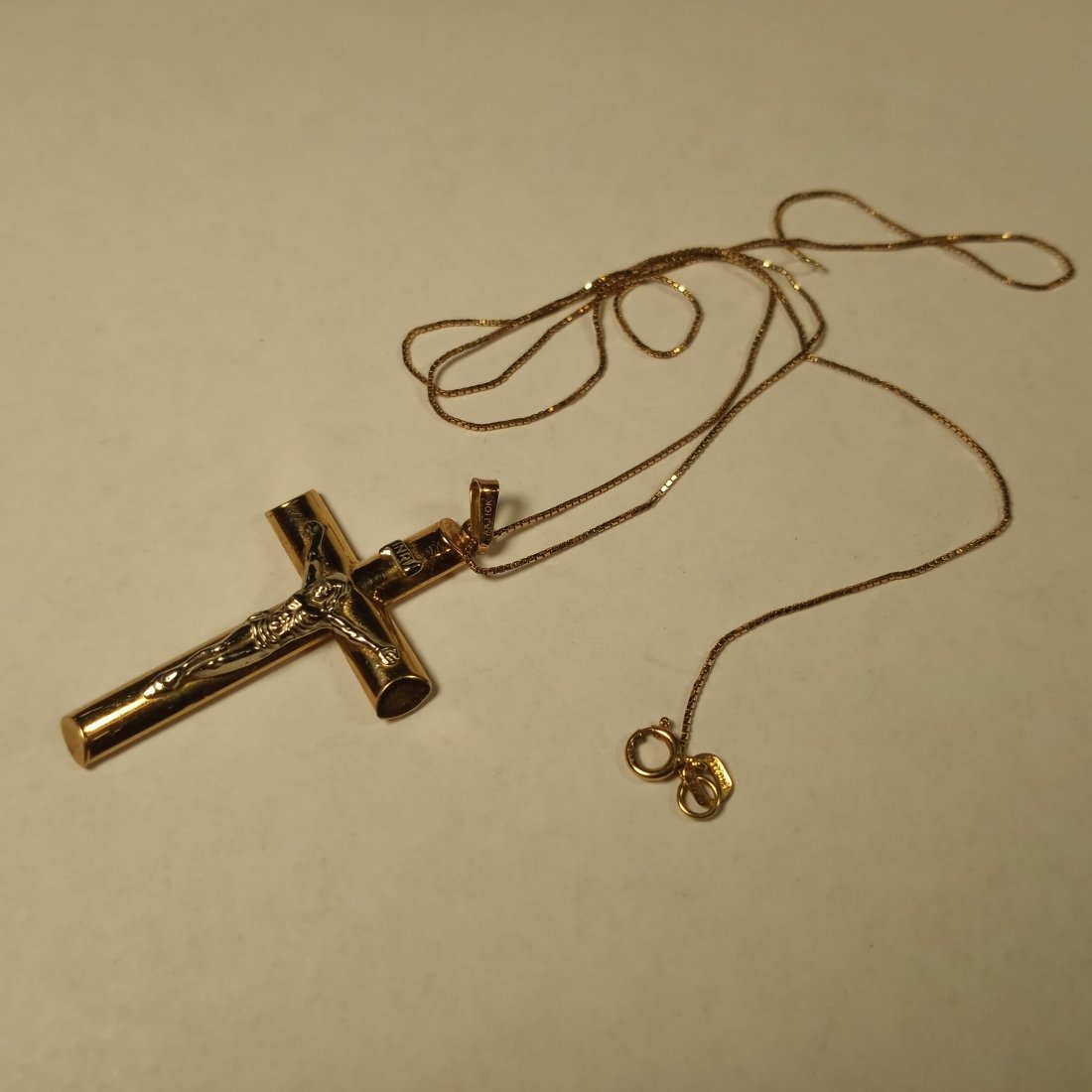 Gold Crucifix Pendant Necklace 10 Karat: 18 inch chain marked at the clasp. Cross marked on the bail. See photos. Both chain and cross marked 10 karat.