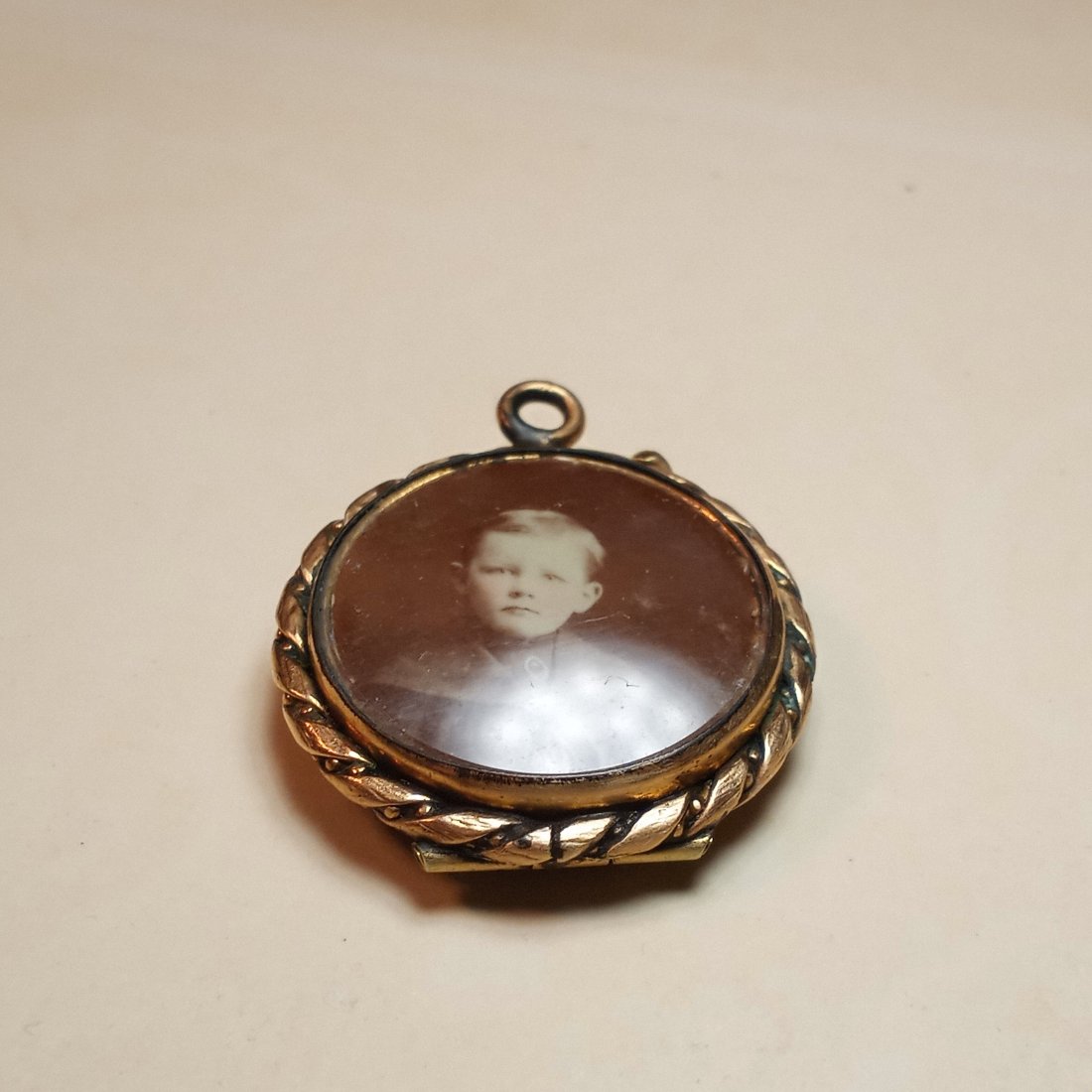 Victorian Antique Gilt Brass Double Locket: Good hinge and snaps good shut. Unfortunately bezel is broken on one side.