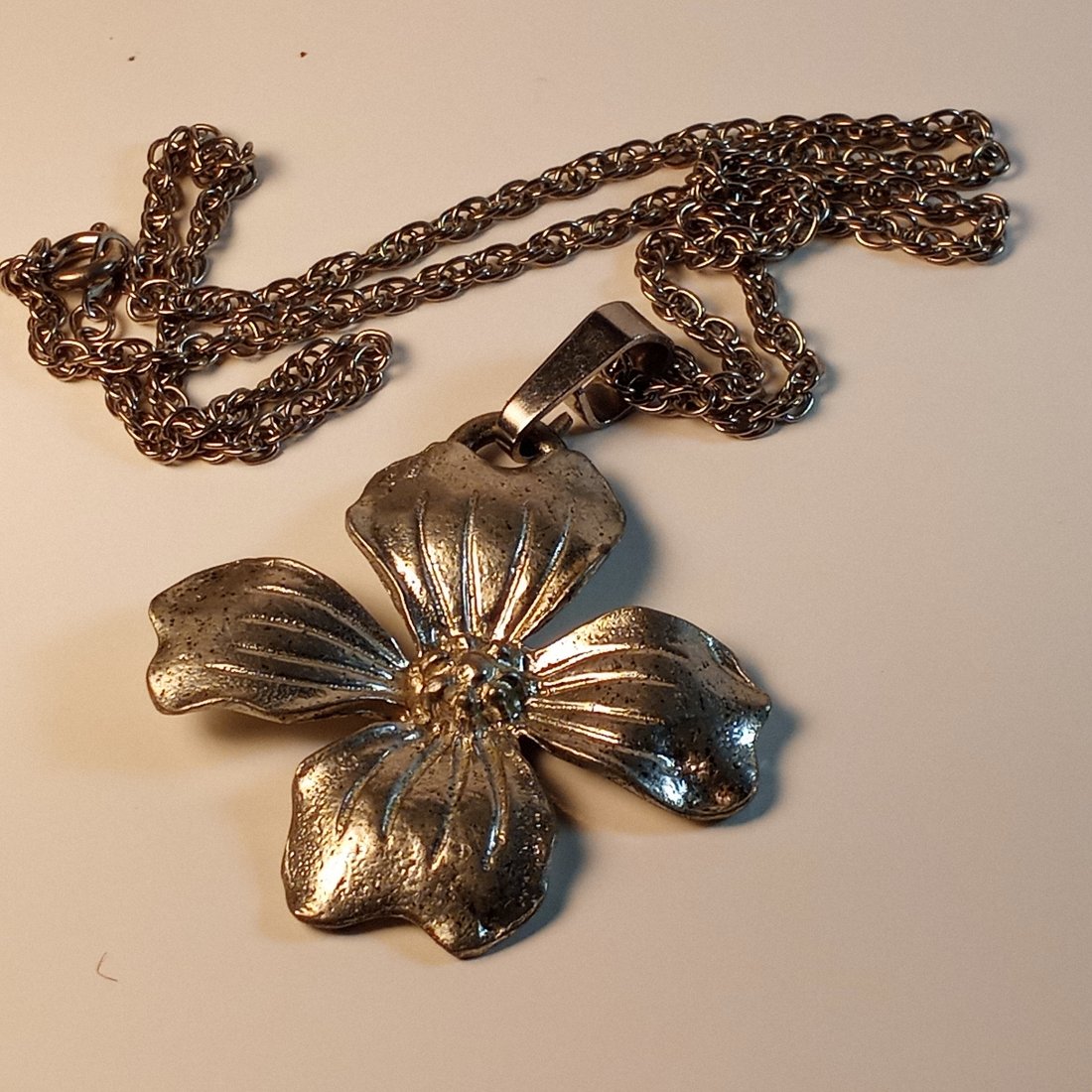 Vintage Homemade Floral Pendant Necklace Dogwood Leaf: A heavy element. Perhaps pewter, an alloy of some kind. Soft. Could be a pure form of silver. 20 inch chain is nickel steel.