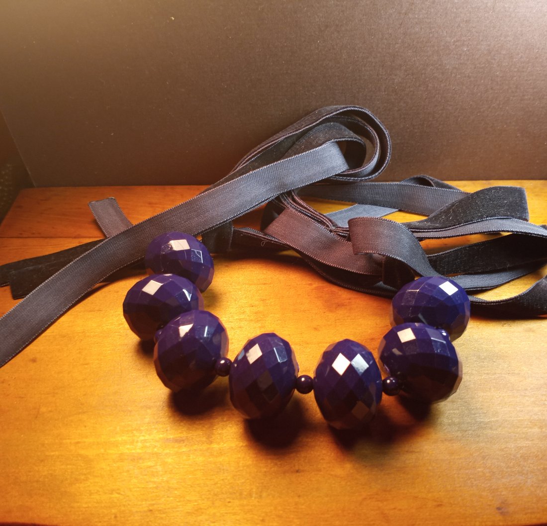Deep Purple: Drops about 26 inches. Ribbon tassel drop behind the neck. See photos. Hard resin, perhaps thermoset.