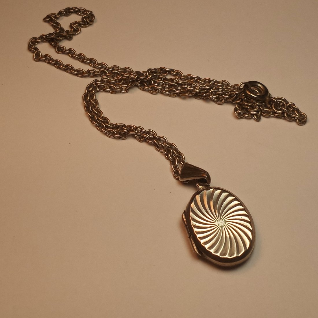 Sterling Silver Vintage Locket Necklace: Has sterling marks which are faded. Both chain and locket silver. Chain 15 inches. Lock snaps shut. Good hinge.