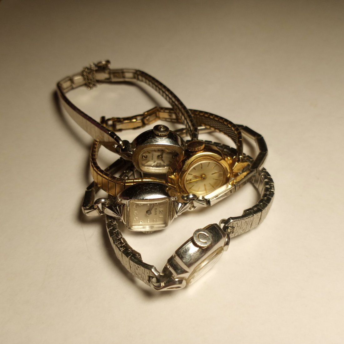 Four Vintage Ladies' Watches: A couple run, but not well. All are clean. A Timex, Elgin, Carravelle and a ...