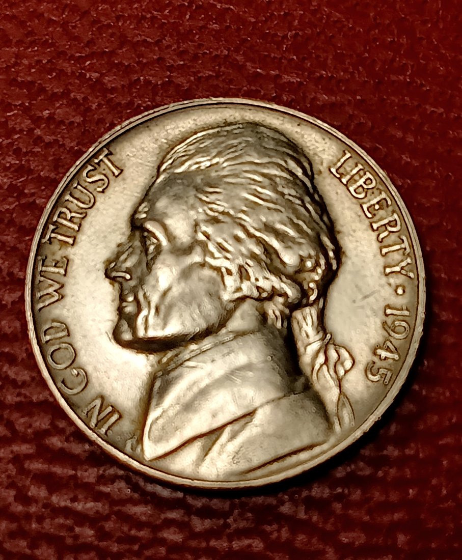 Strong ++ Jefferson Silver Alloy War Nickel Unique: 35-40% silver content. The wire edge around the rim suggests a proof coin, but statistically there were no 1945 Philadelphia proof coins minted. Strong strike. Observe detail of Jefferson's hair and c